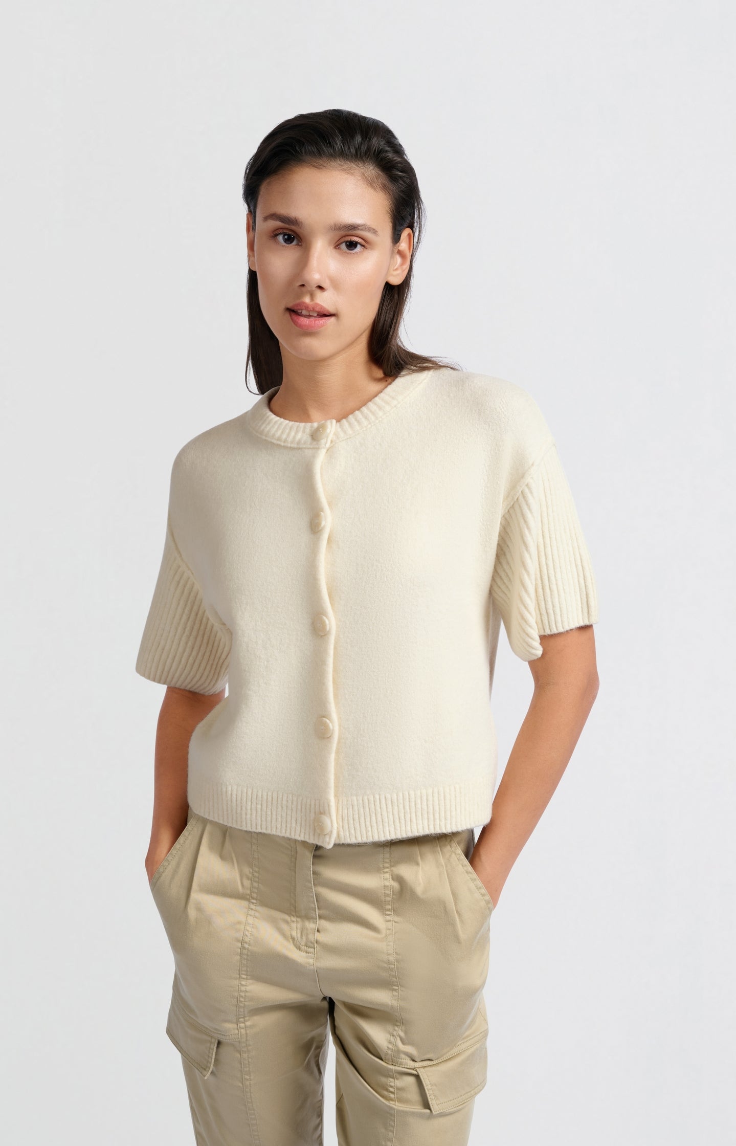 Cream-colored cardigan with short wide sleeves and round nec