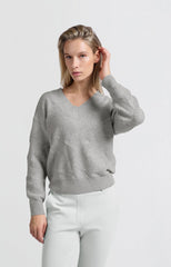 Knitted sweater with V-neck and textured pattern