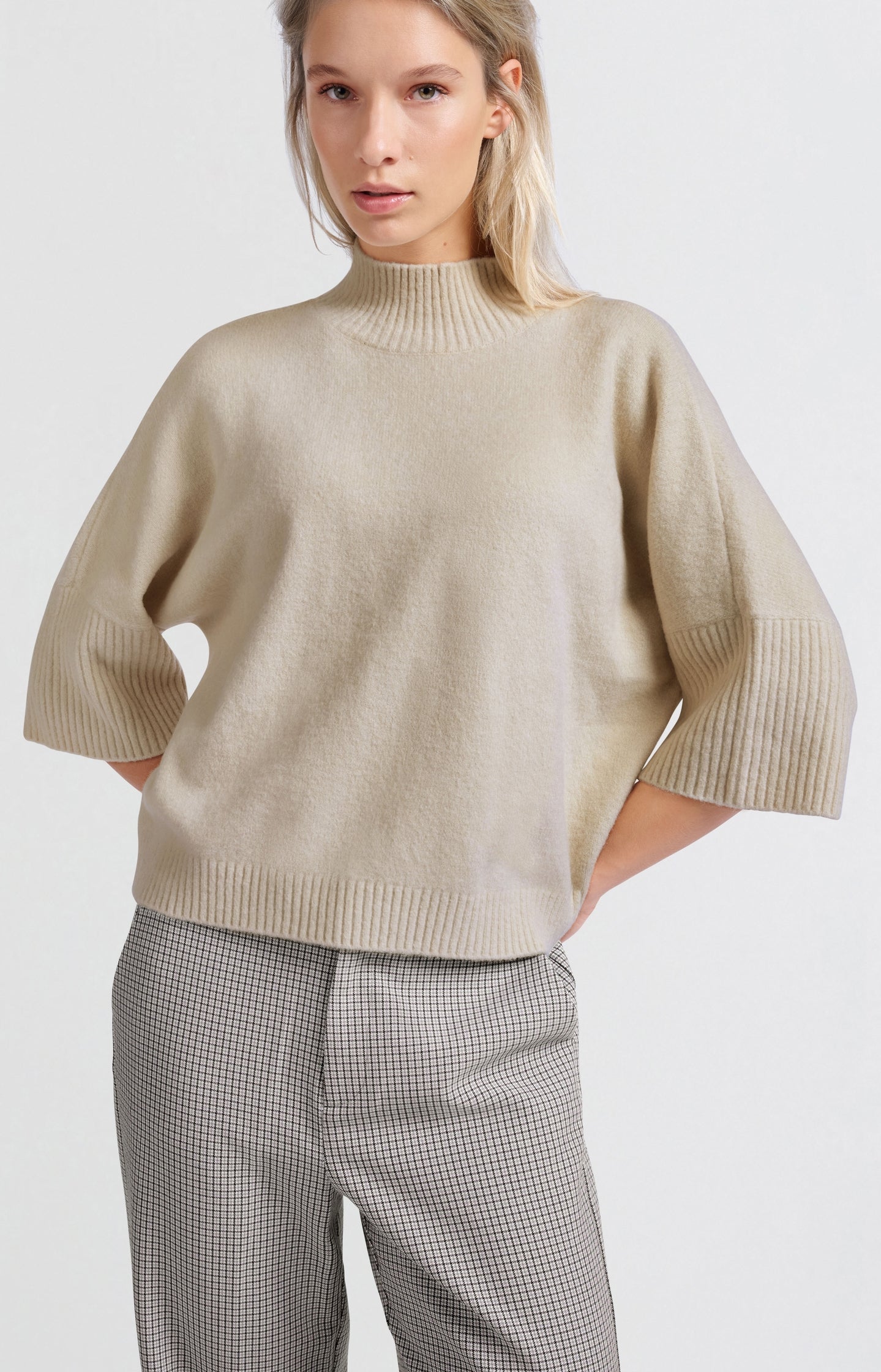 Soft sweater with high neck and three-quarter sleeves