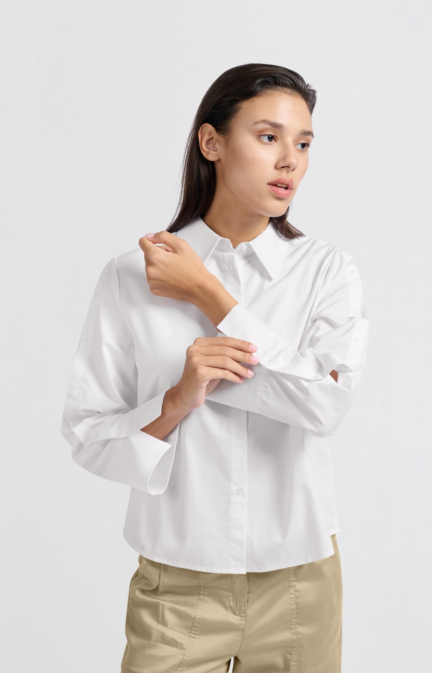 White blouse with long sleeves and button details